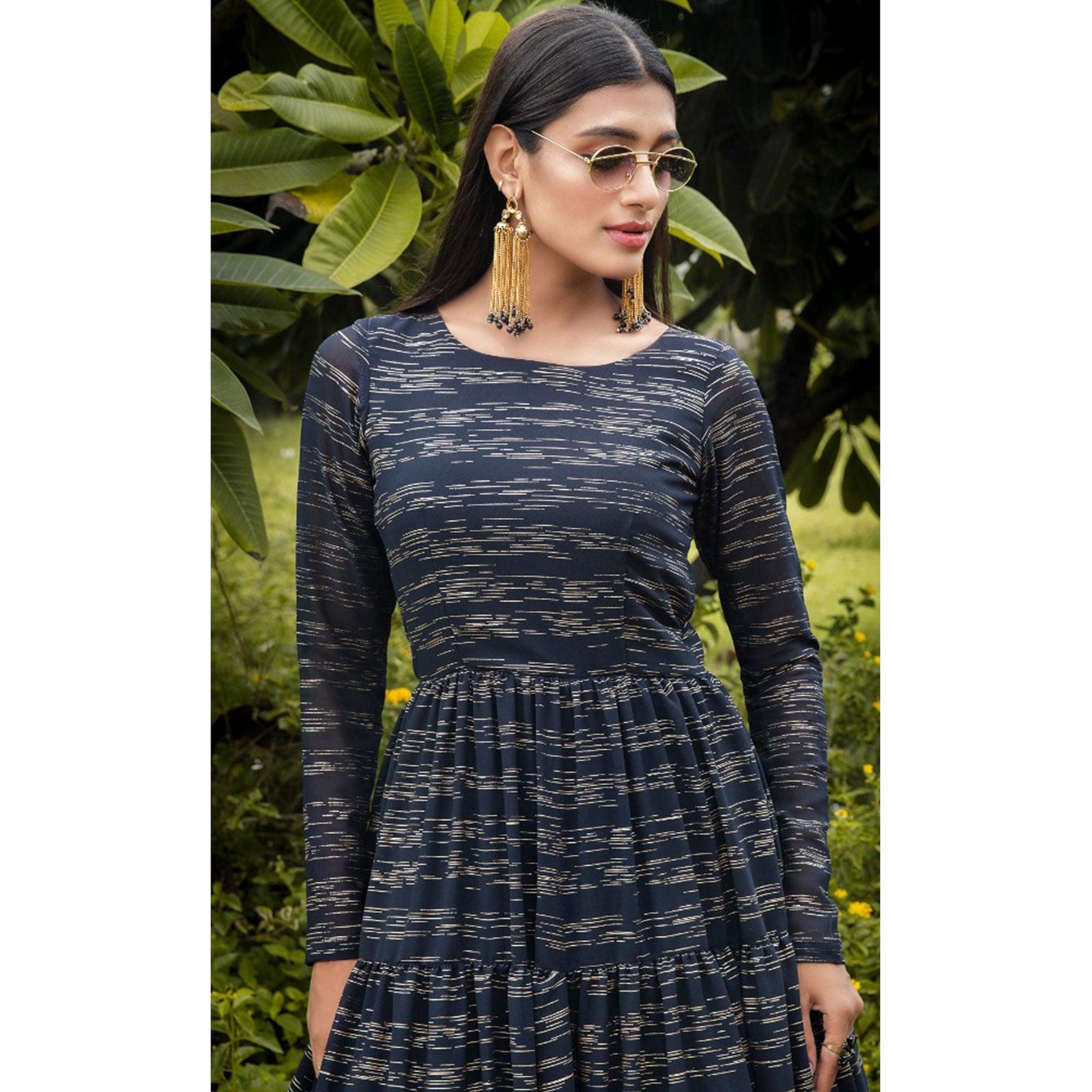 Hypnotic Navy Blue Colored Party Wear Foil Printed Georgette Gown