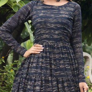 Hypnotic Navy Blue Colored Party Wear Foil Printed Georgette Gown