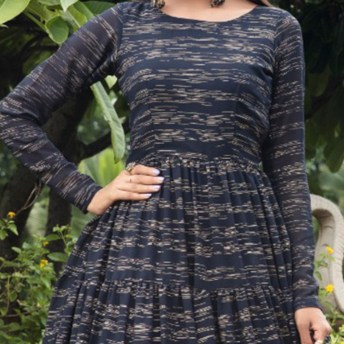 Hypnotic Navy Blue Colored Party Wear Foil Printed Georgette Gown