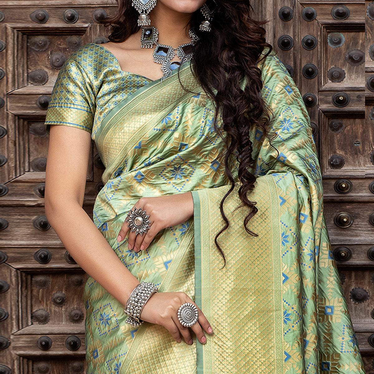 Hypnotic Pista Green Colored Festive Wear Woven Banarasi Silk Saree