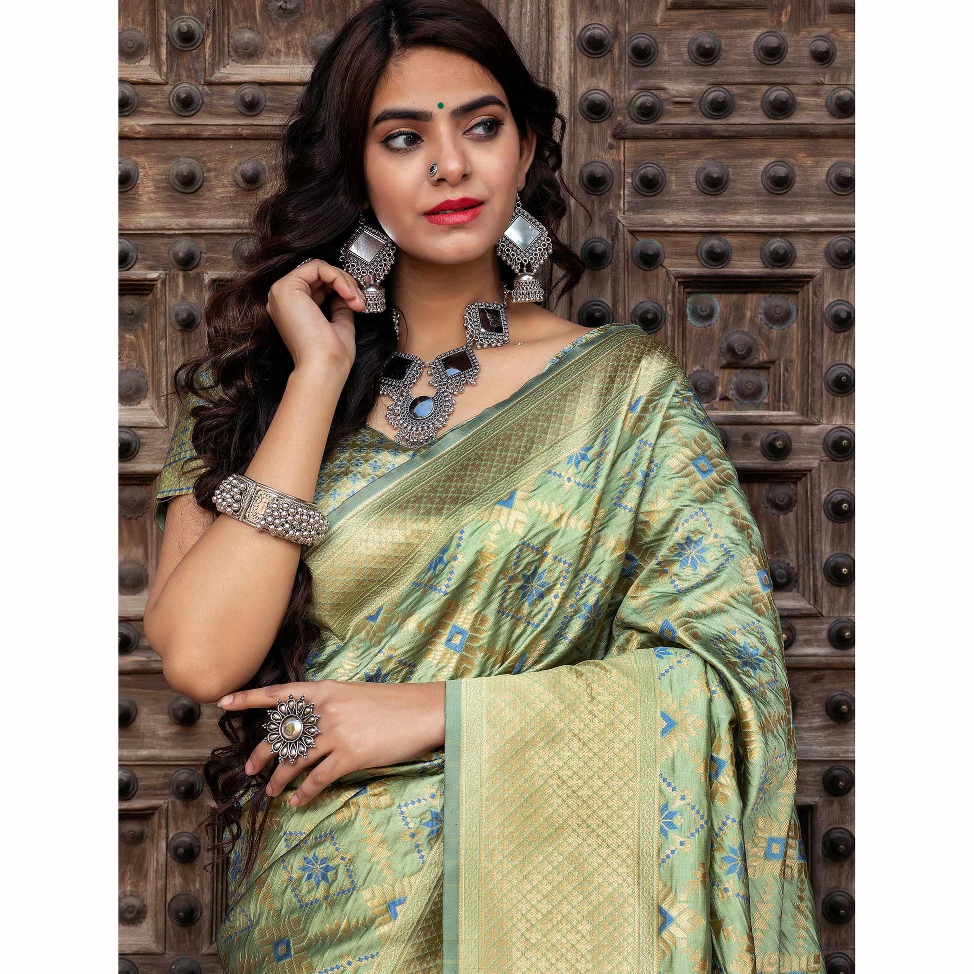 Hypnotic Pista Green Colored Festive Wear Woven Banarasi Silk Saree
