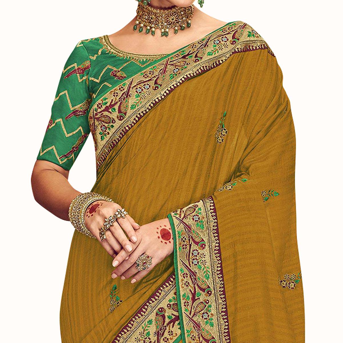 Ideal Mustard Yellow Colored Partywear Embroidered Georgette Saree