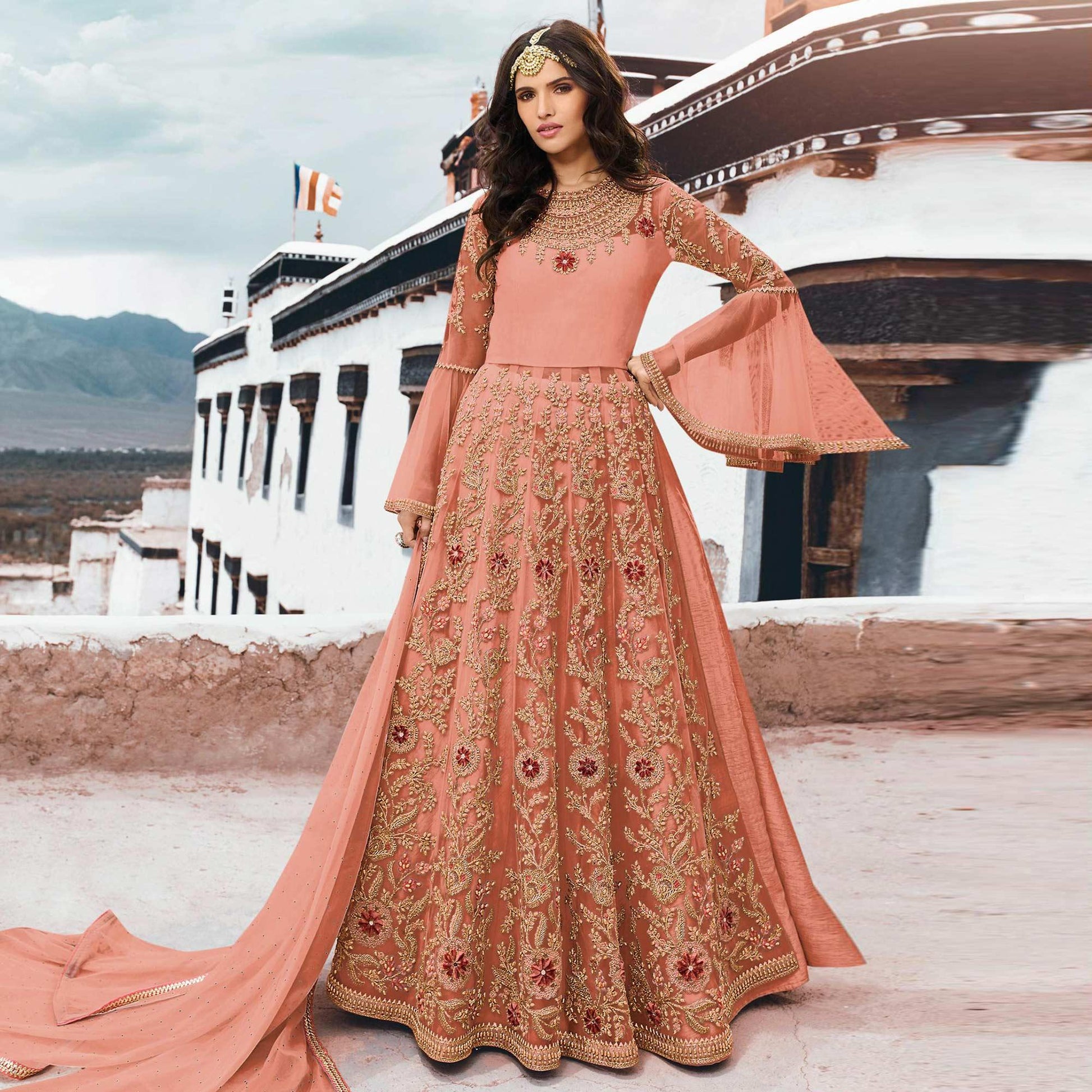 Ideal Peach Colored Partywear Embroidered Netted Anarkali Suit