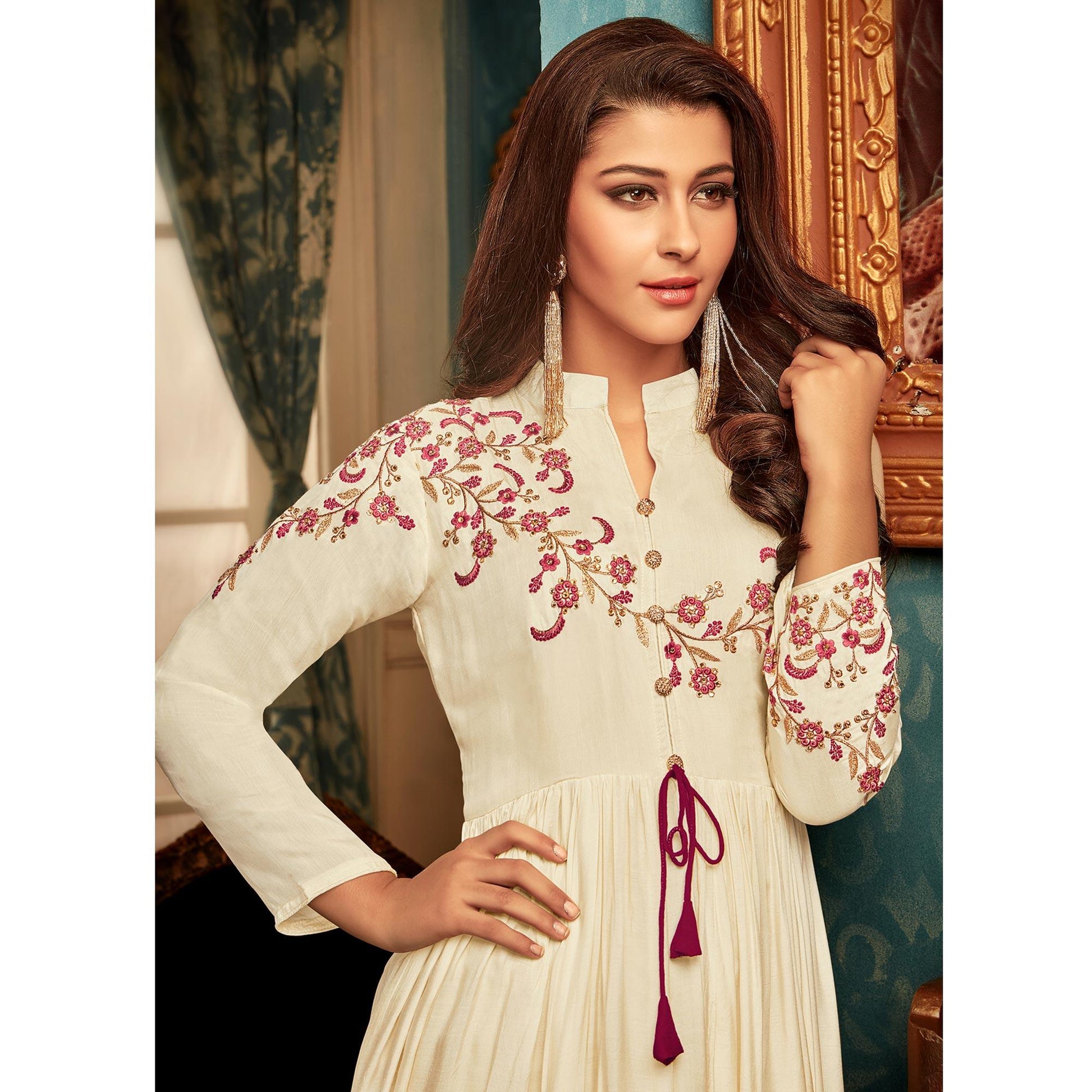 Imposing Cream Colored Partywear Embroidered Heavy Muslin Gown