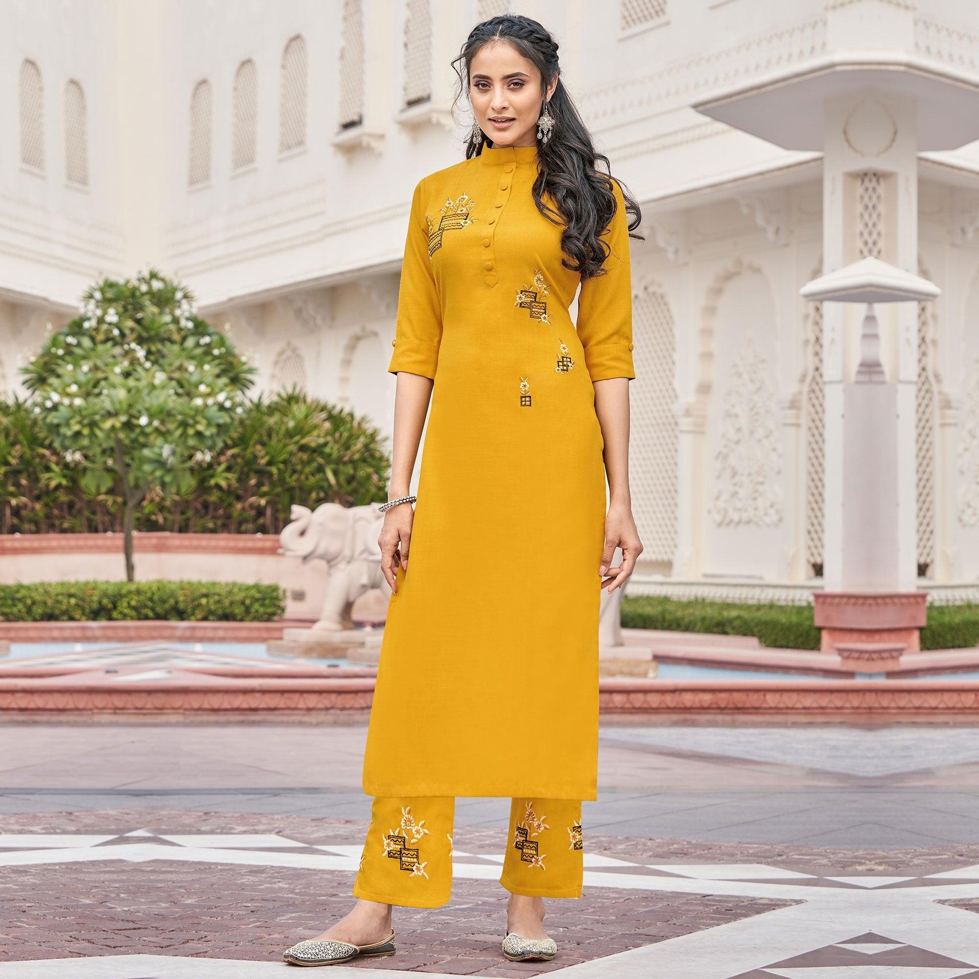 Imposing Mutard Yellow Colored Partywear Embroidered Cotton Slub Kurti Palazzo Set
