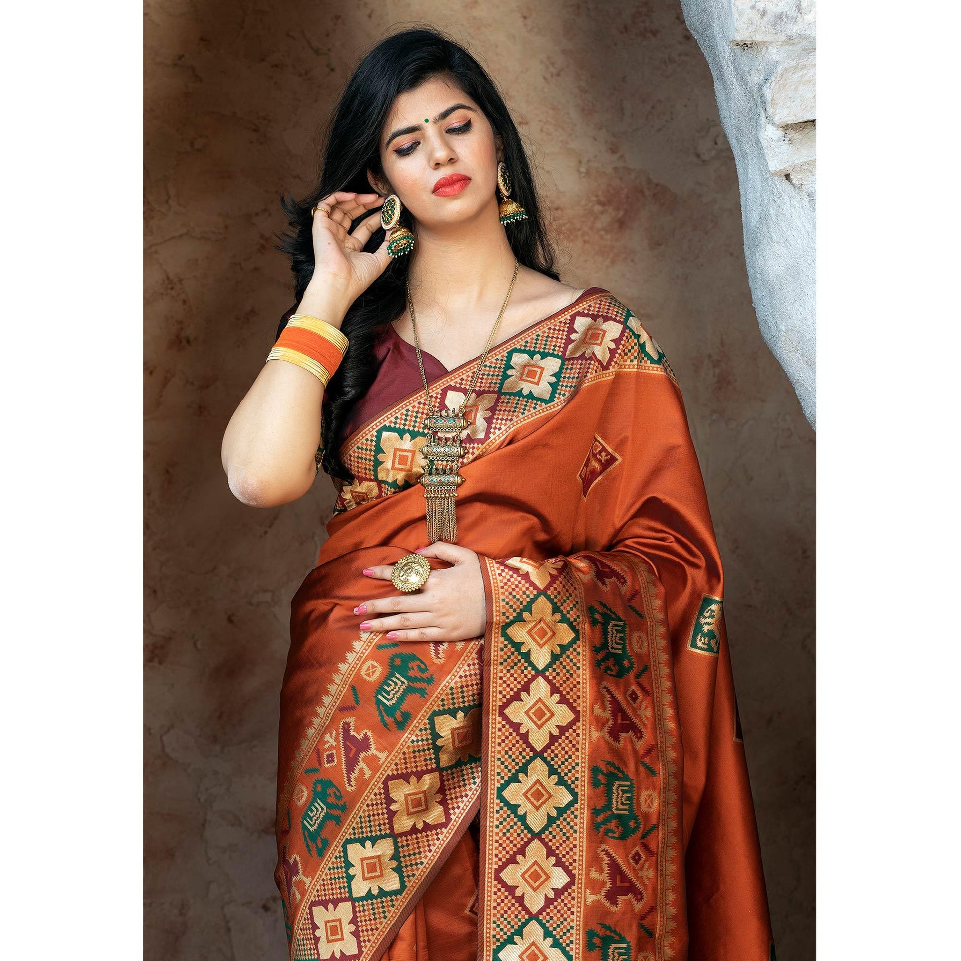 Imposing Orange Colored Festive Wear Woven Patola Silk Saree