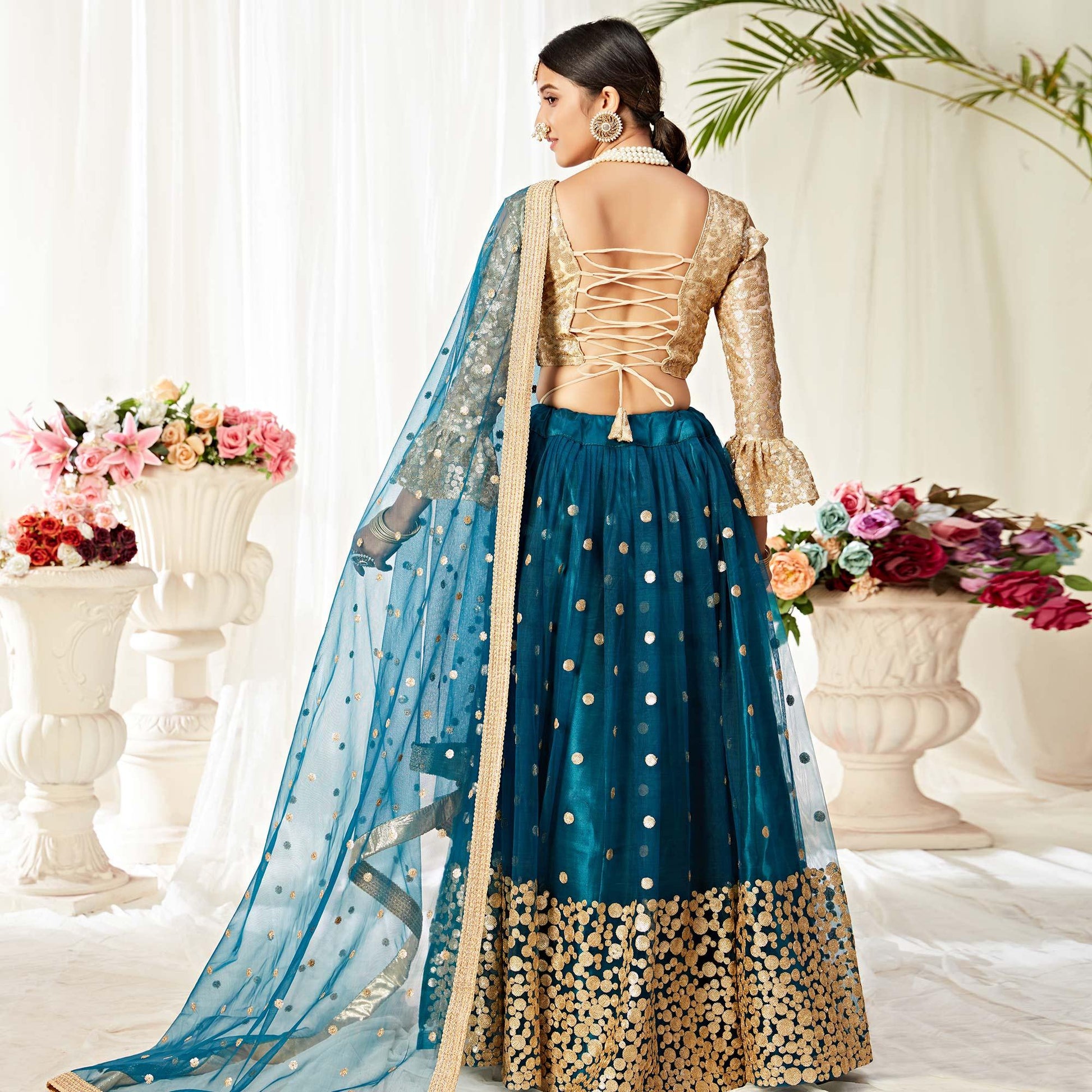 Imposing Peacock Blue Colored Wedding Wear Embroidered Heavy Net Lehenga Choli
