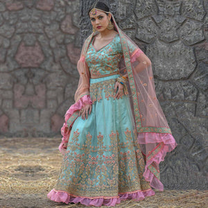 Imposing Turquoise Colored Party Wear Embroidered Net Lehenga Choli