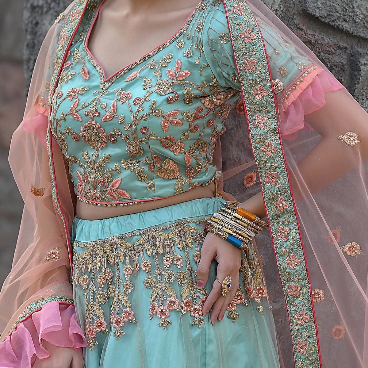 Imposing Turquoise Colored Party Wear Embroidered Net Lehenga Choli