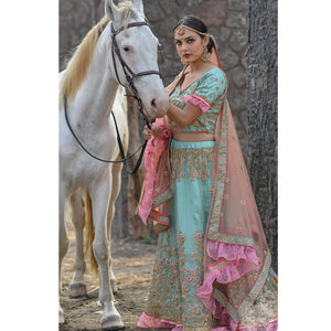 Imposing Turquoise Colored Party Wear Embroidered Net Lehenga Choli