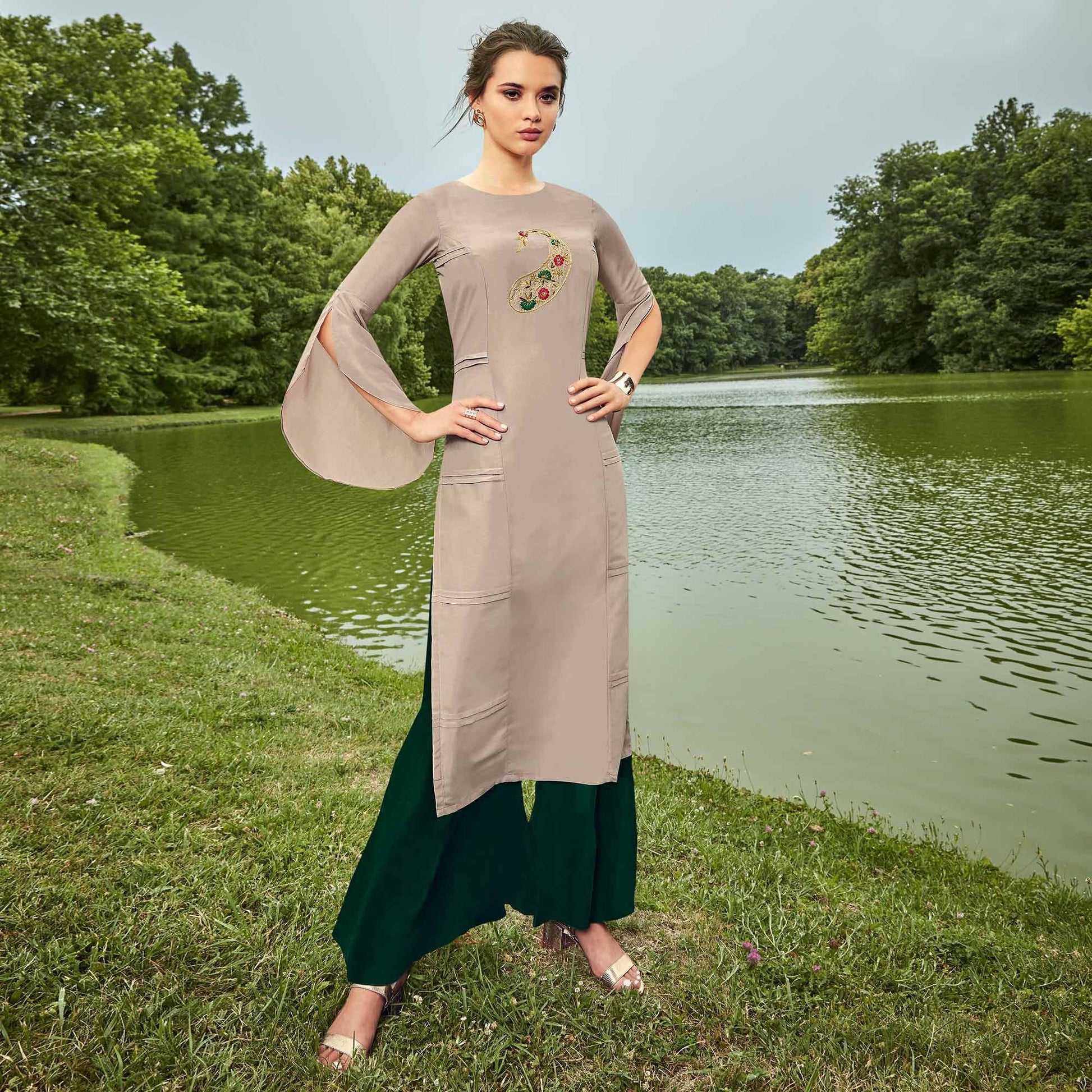 Impressive Light Grey Colored Partywear Hand Embroidered Muslin Silk Kurti-Palazzo Set