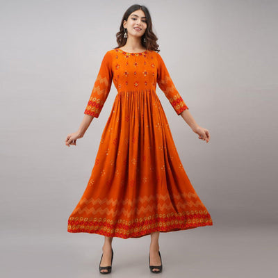 Impressive Orange Colored Partywear Embroidered Muslin Long Kurti