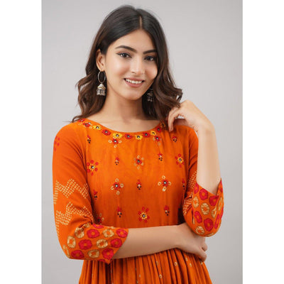 Impressive Orange Colored Partywear Embroidered Muslin Long Kurti