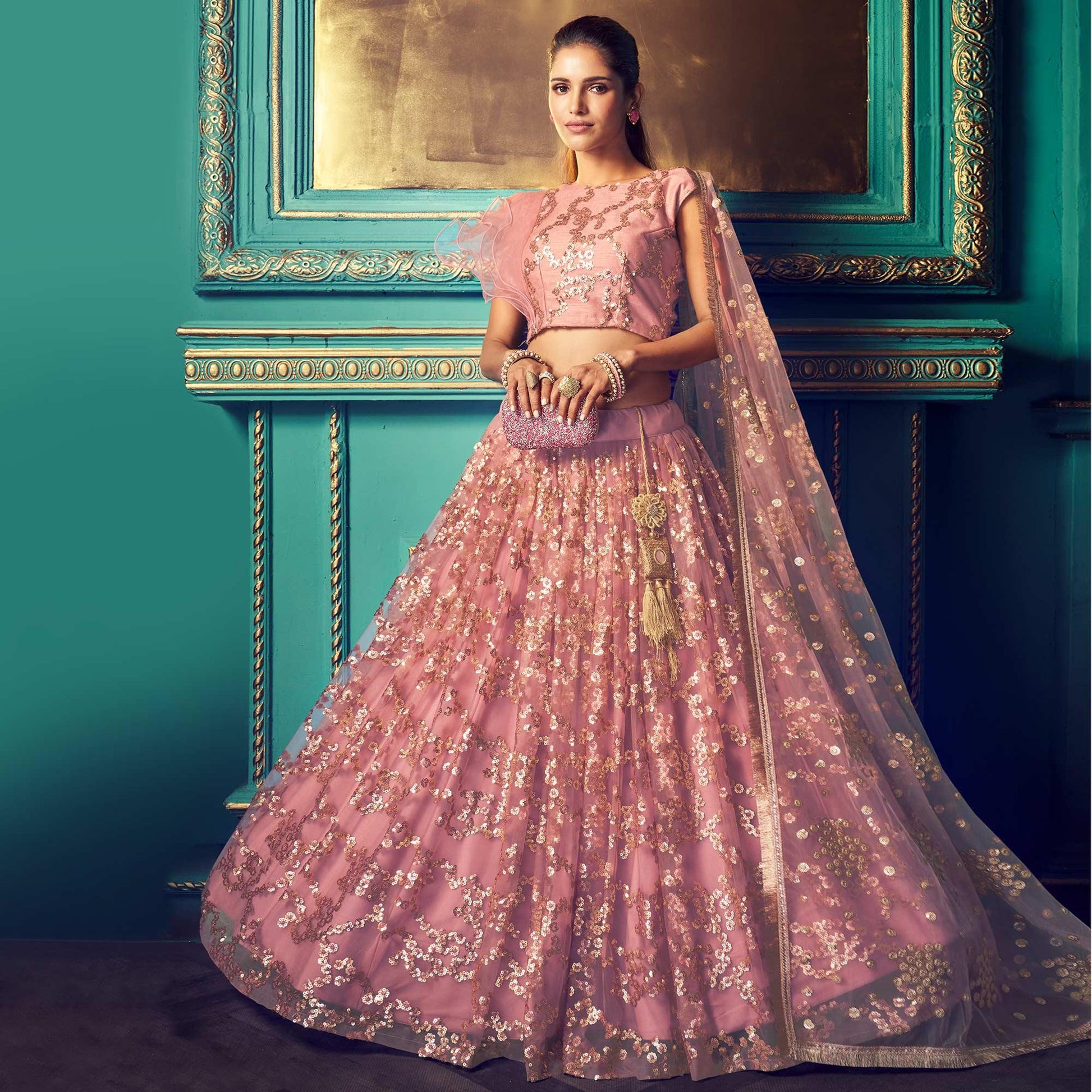 Impressive Purple Colored Partywear Embroidered Soft Net Lehenga Choli
