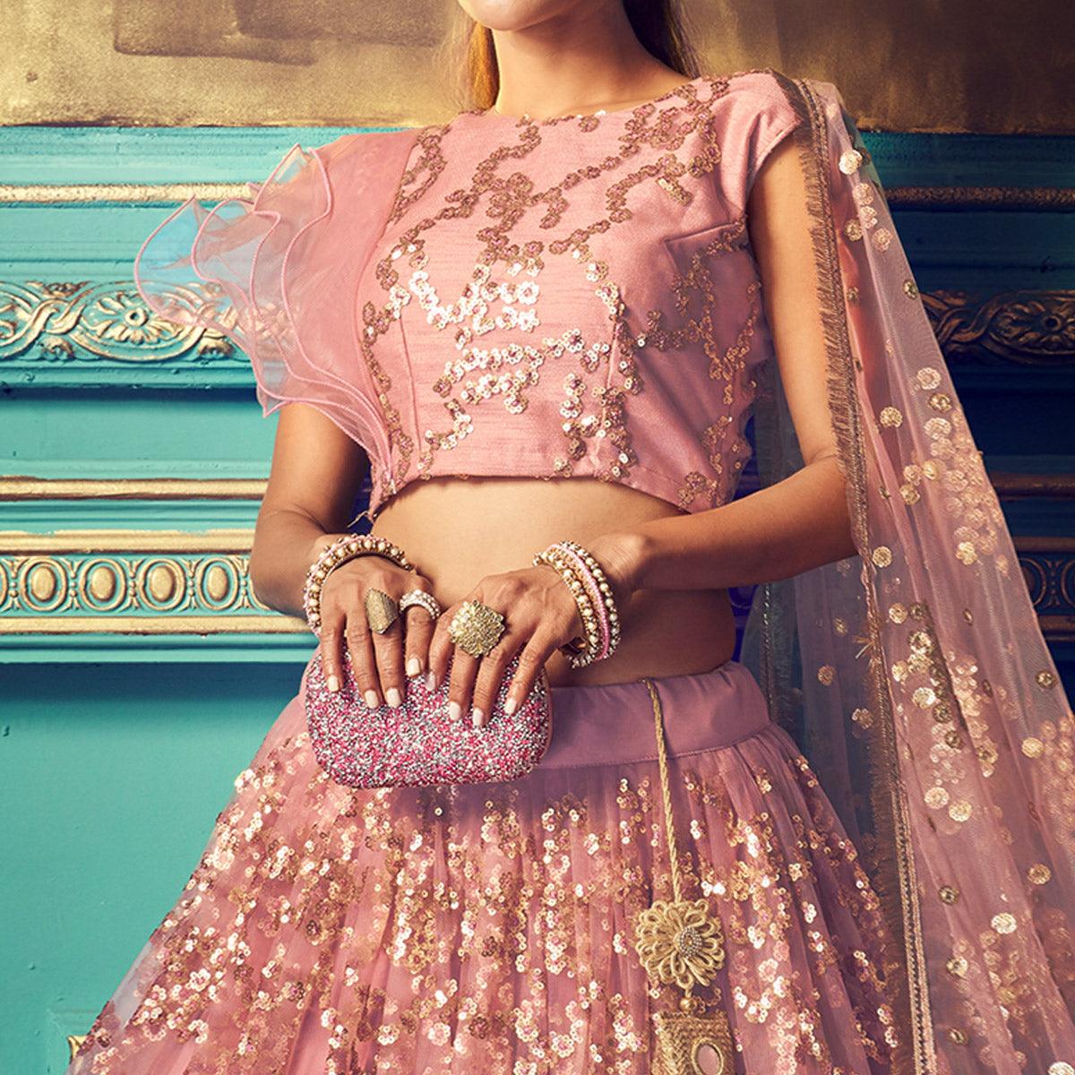Impressive Purple Colored Partywear Embroidered Soft Net Lehenga Choli