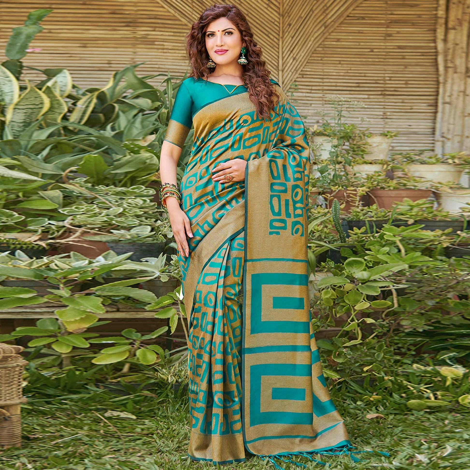 Impressive Teal Blue Colored Festive Wear Floral Woven Silk Blend Saree With Tassels