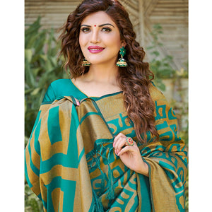 Impressive Teal Blue Colored Festive Wear Floral Woven Silk Blend Saree With Tassels