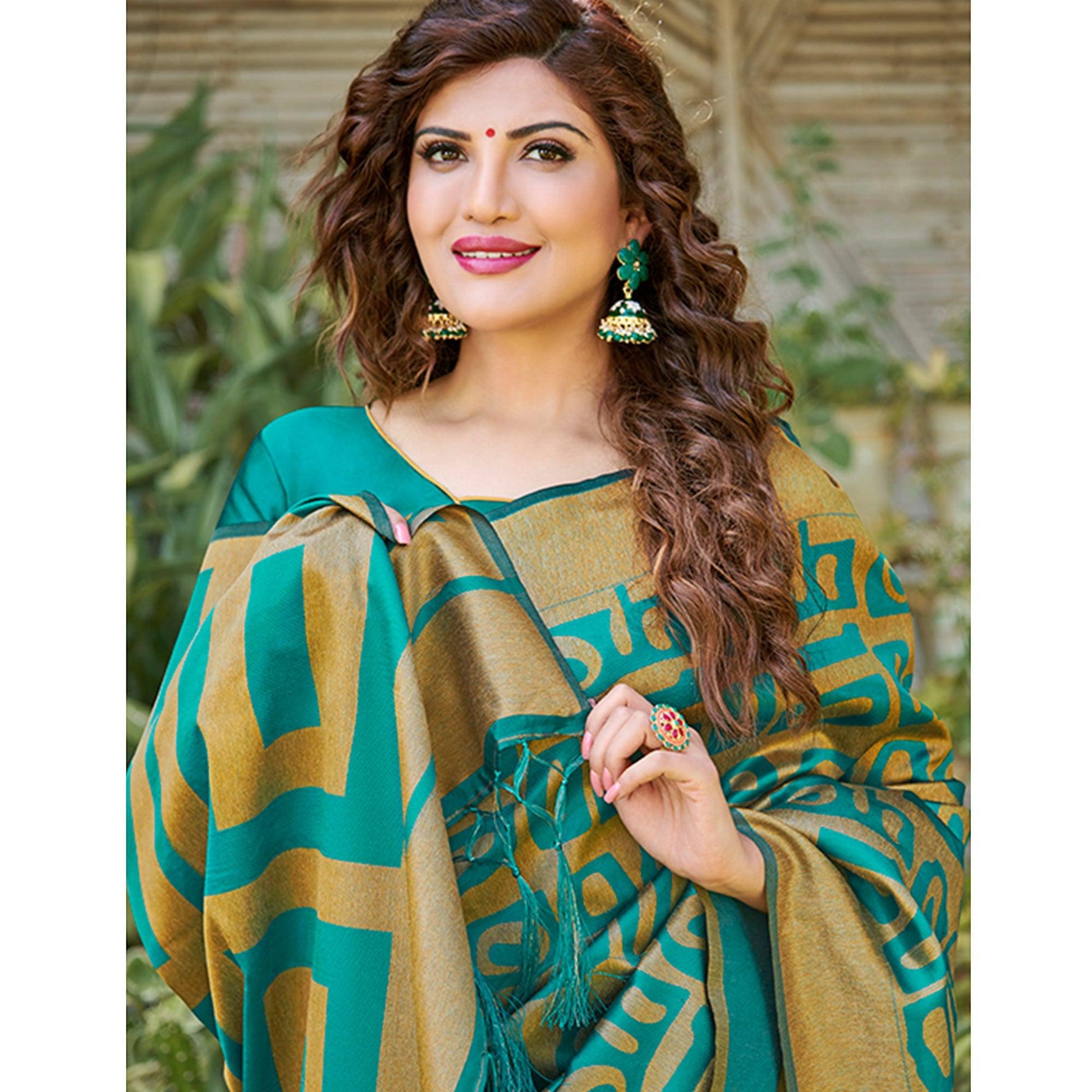 Impressive Teal Blue Colored Festive Wear Floral Woven Silk Blend Saree With Tassels