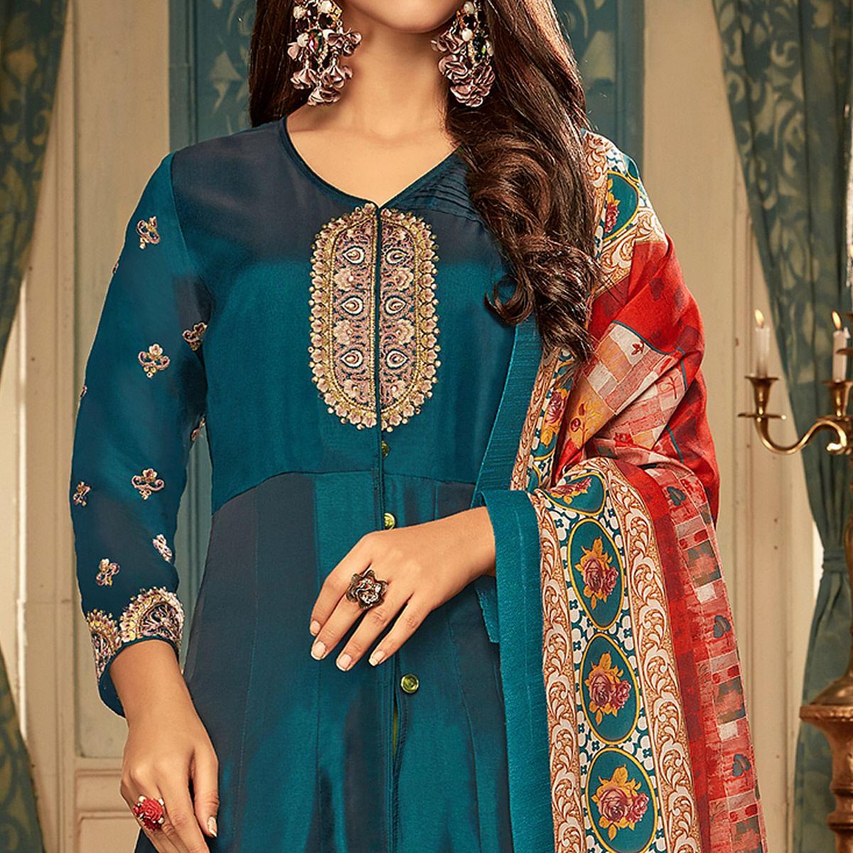 Impressive Teal Blue Colored Partywear Embroidered Heavy Muslin Gown