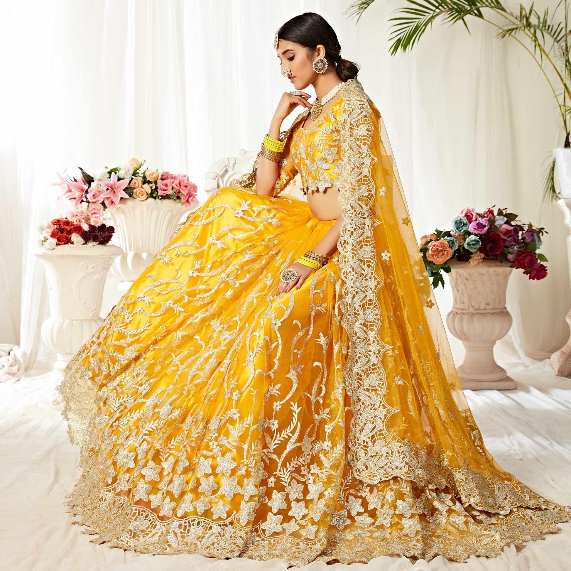 Impressive Yellow Colored Wedding Wear Embroidered Heavy Net Lehenga Choli