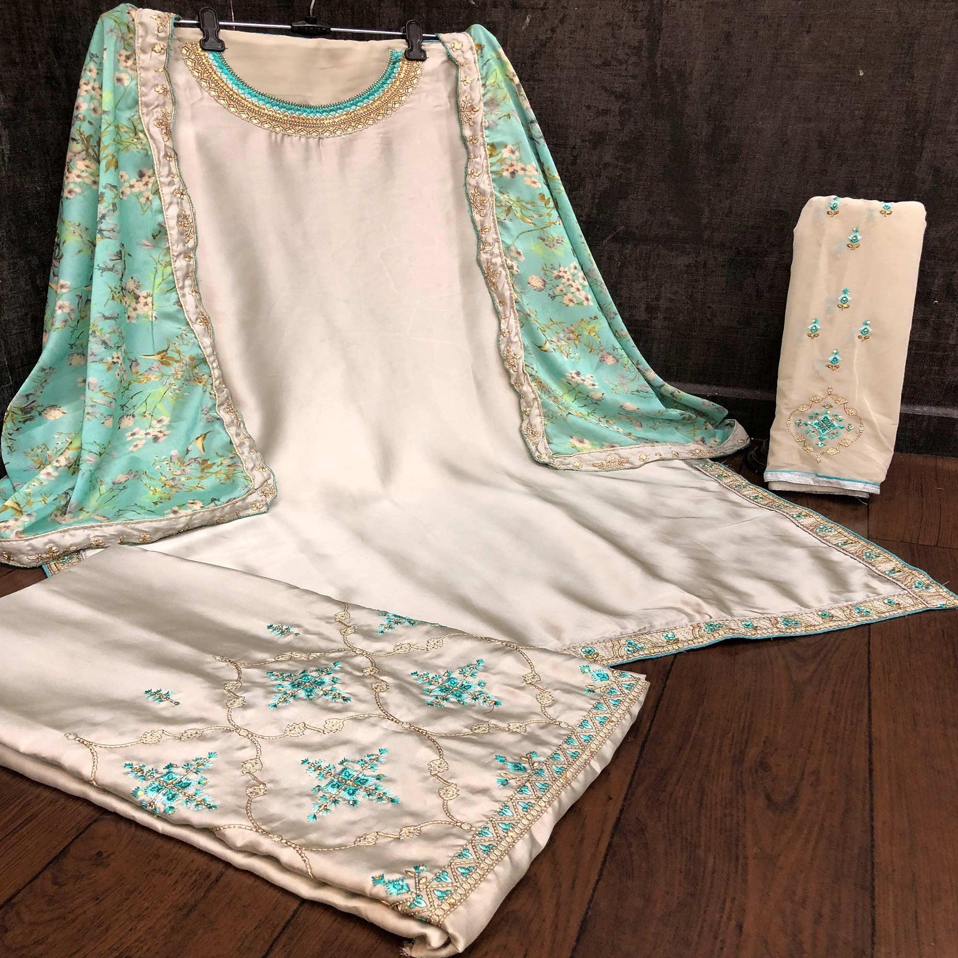 Innovative Grey Colored Partywear Embroidered Muslin Satin Gharara Suit With Palazzo