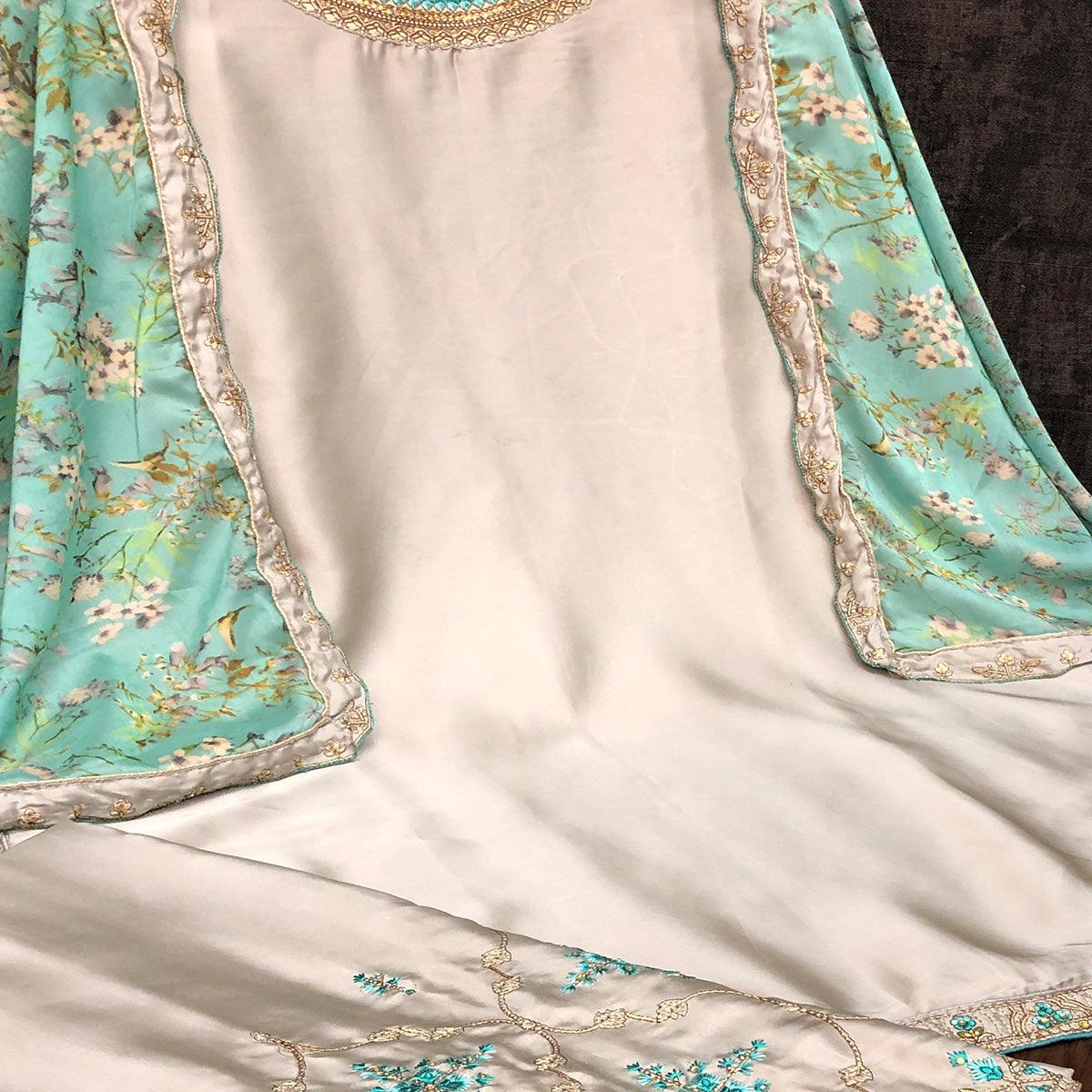 Innovative Grey Colored Partywear Embroidered Muslin Satin Gharara Suit With Palazzo