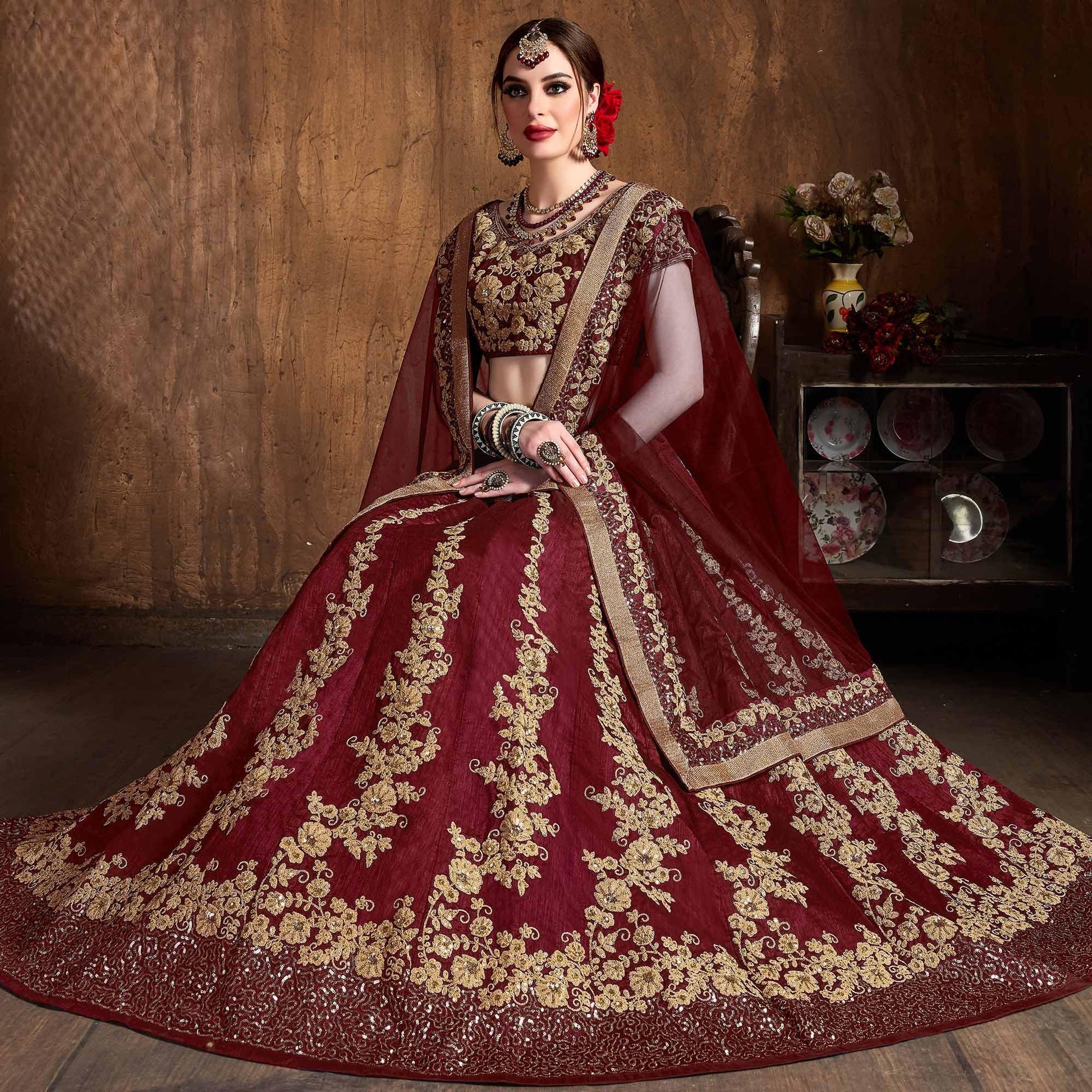Innovative Maroon Colored Wedding Wear Embroidered Raw Silk Lehenga