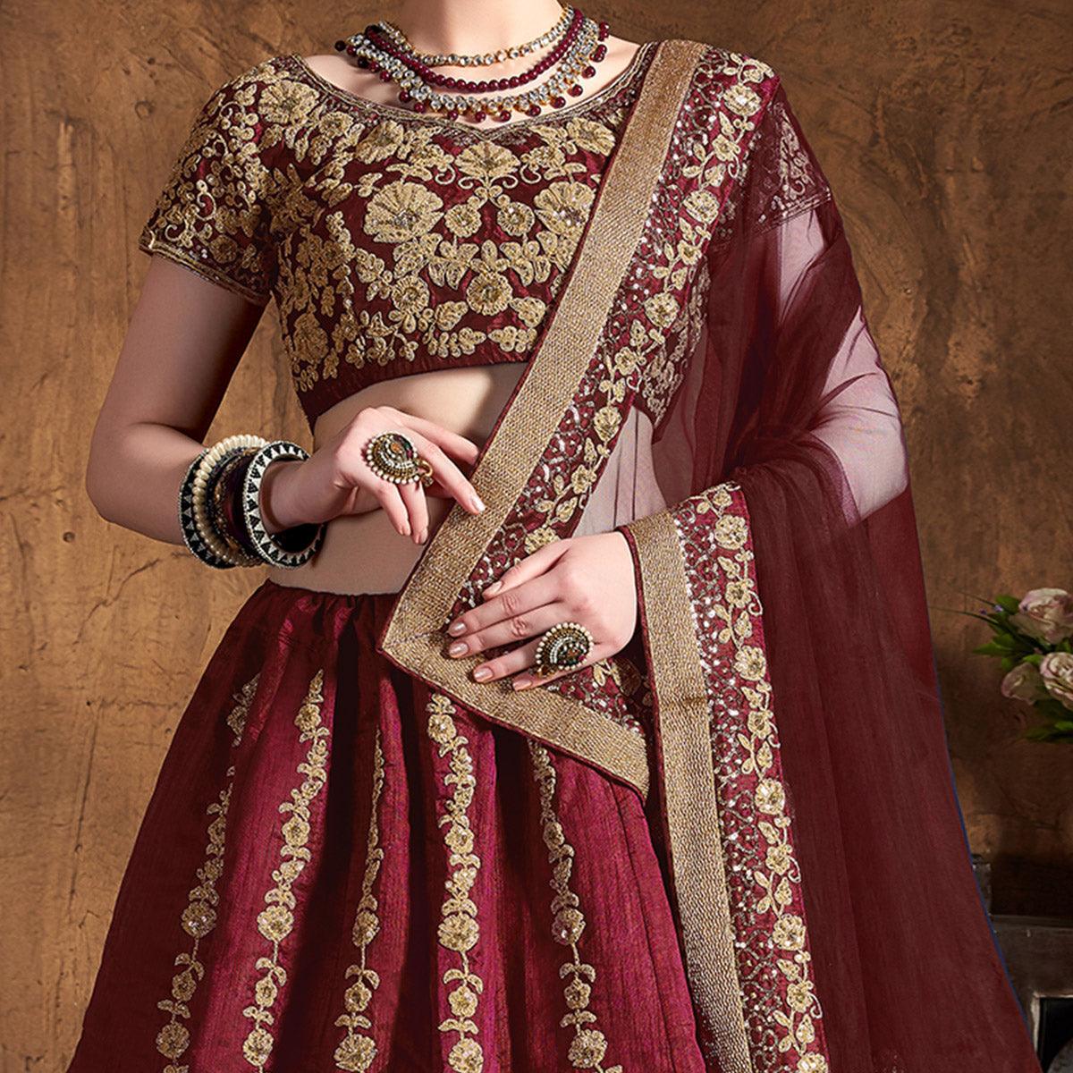 Innovative Maroon Colored Wedding Wear Embroidered Raw Silk Lehenga