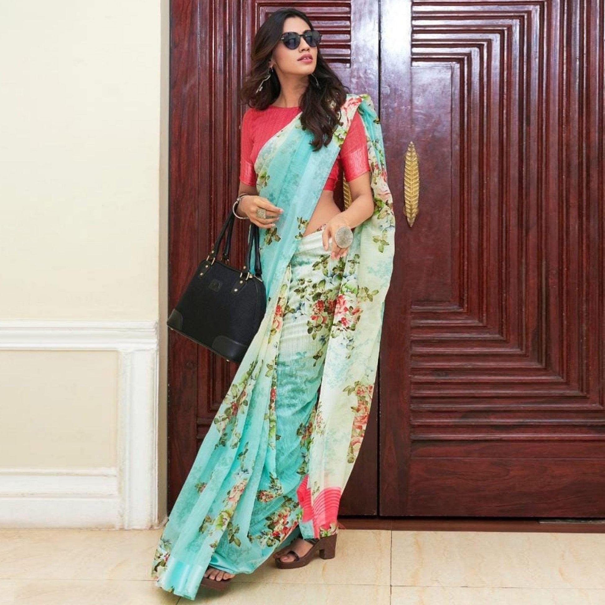 Intricate Aqua Blue Colored Casual Wear Floral Printed Linen Saree