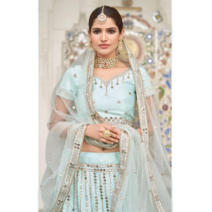 Intricate Ice Blue Coloured Wedding Wear Mirror Work Heavy Silk Lehenga Choli