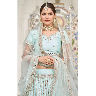 Intricate Ice Blue Coloured Wedding Wear Mirror Work Heavy Silk Lehenga Choli