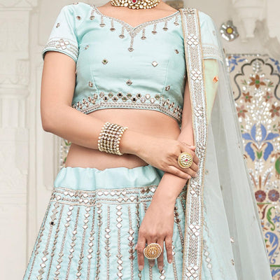 Intricate Ice Blue Coloured Wedding Wear Mirror Work Heavy Silk Lehenga Choli