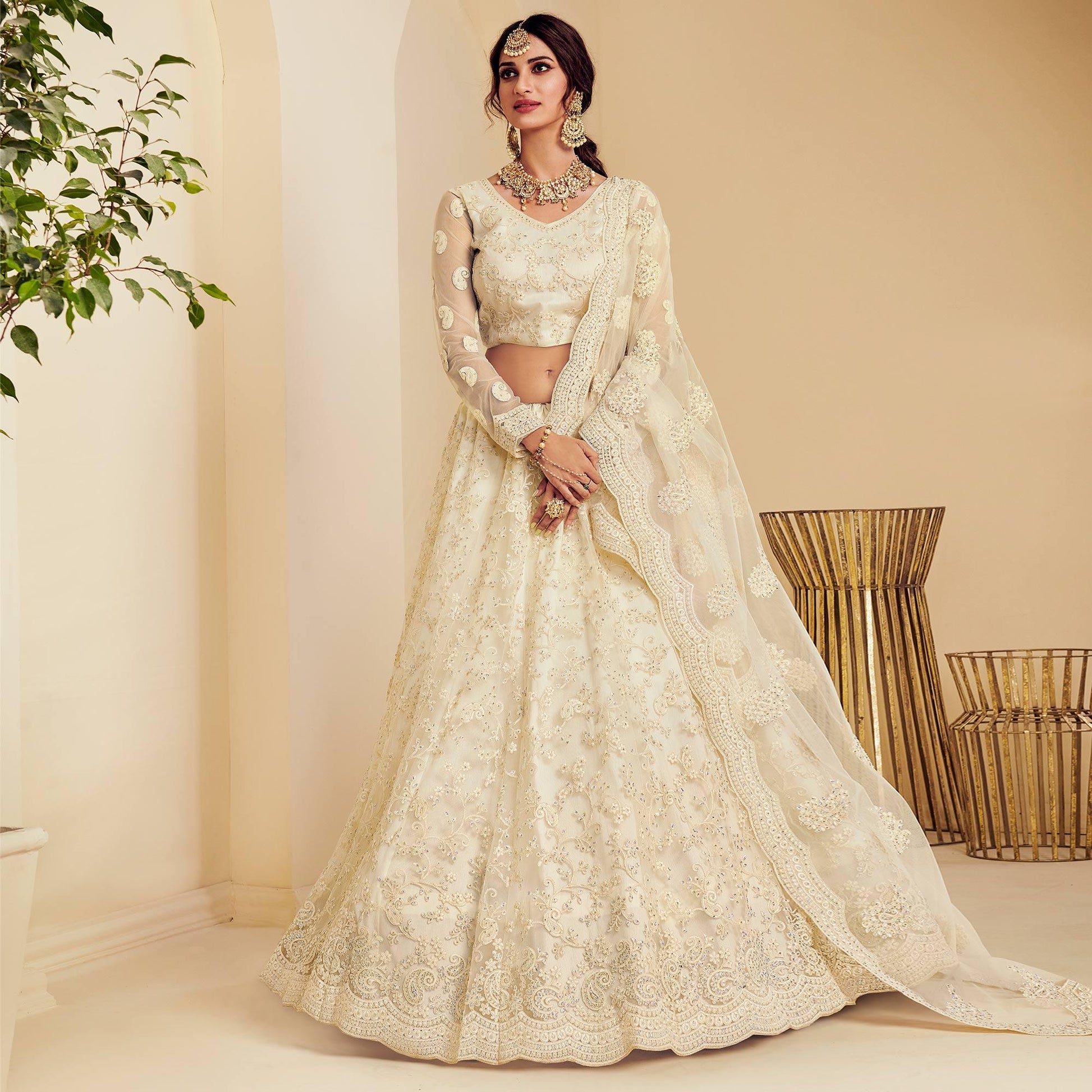 Intricate Off White Coloured Wedding Wear Cording Embroidered Net Lehenga Choli