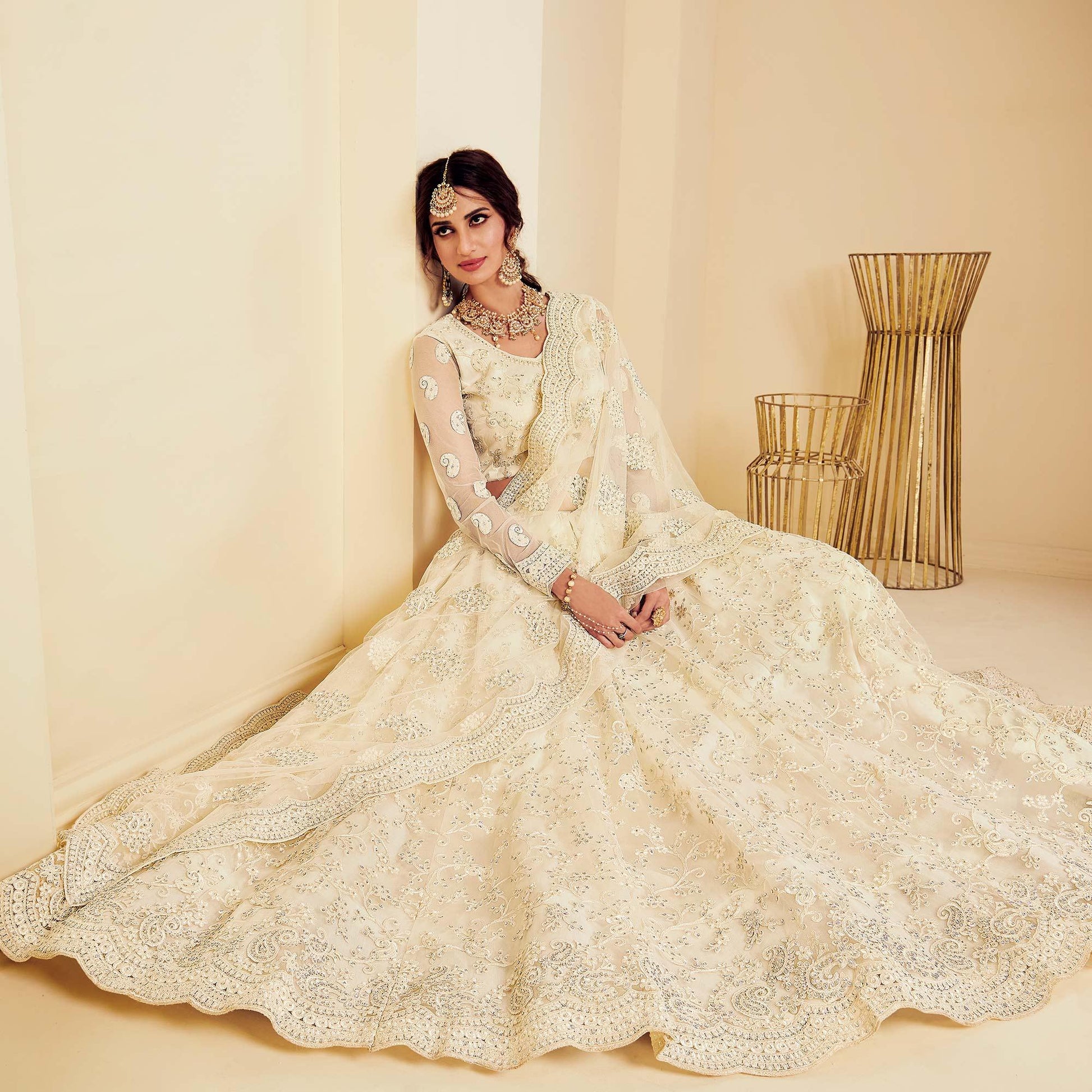 Intricate Off White Coloured Wedding Wear Cording Embroidered Net Lehenga Choli