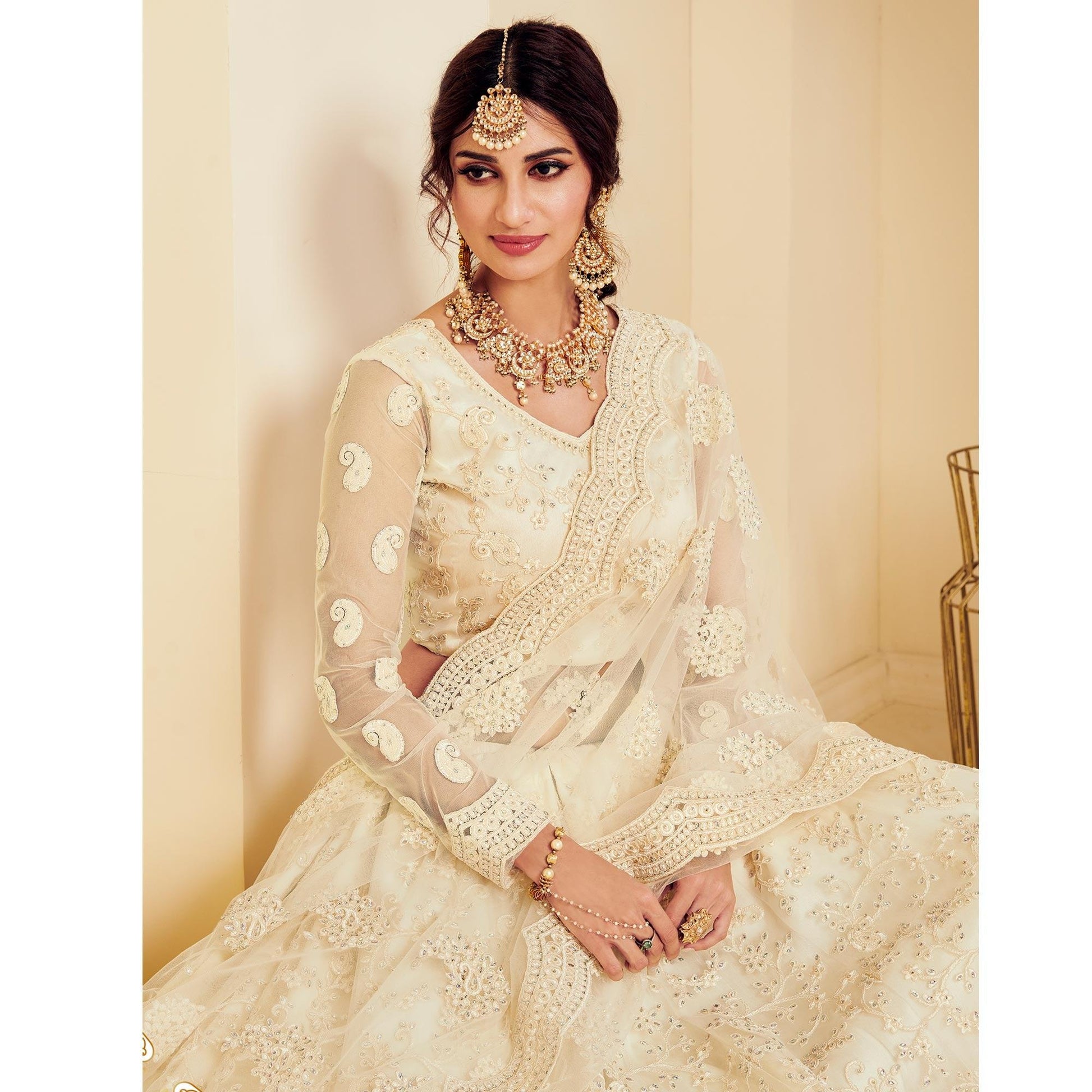 Intricate Off White Coloured Wedding Wear Cording Embroidered Net Lehenga Choli