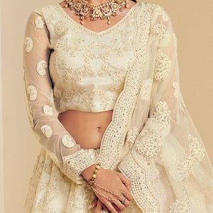Intricate Off White Coloured Wedding Wear Cording Embroidered Net Lehenga Choli