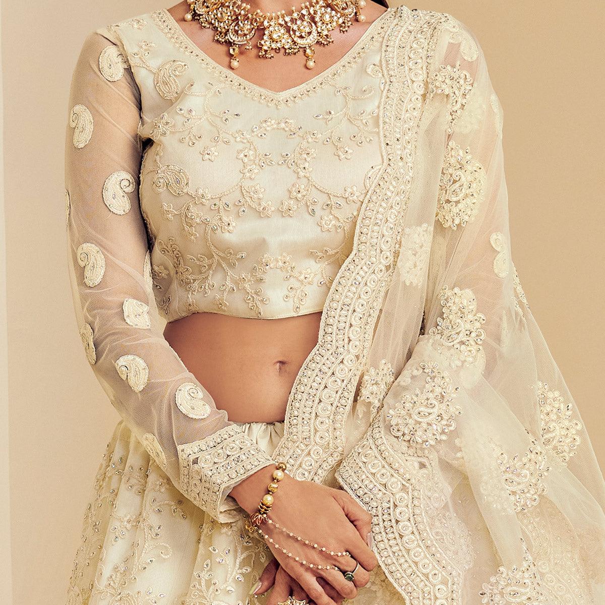 Intricate Off White Coloured Wedding Wear Cording Embroidered Net Lehenga Choli