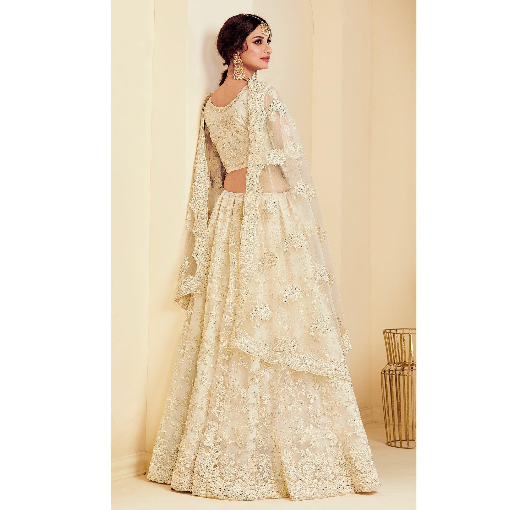 Intricate Off White Coloured Wedding Wear Cording Embroidered Net Lehenga Choli
