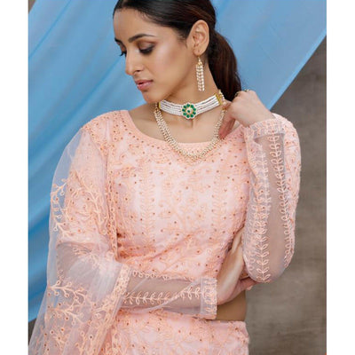 Intricate Peach Colored Party Wear Embroidered Net Lehenga Choli