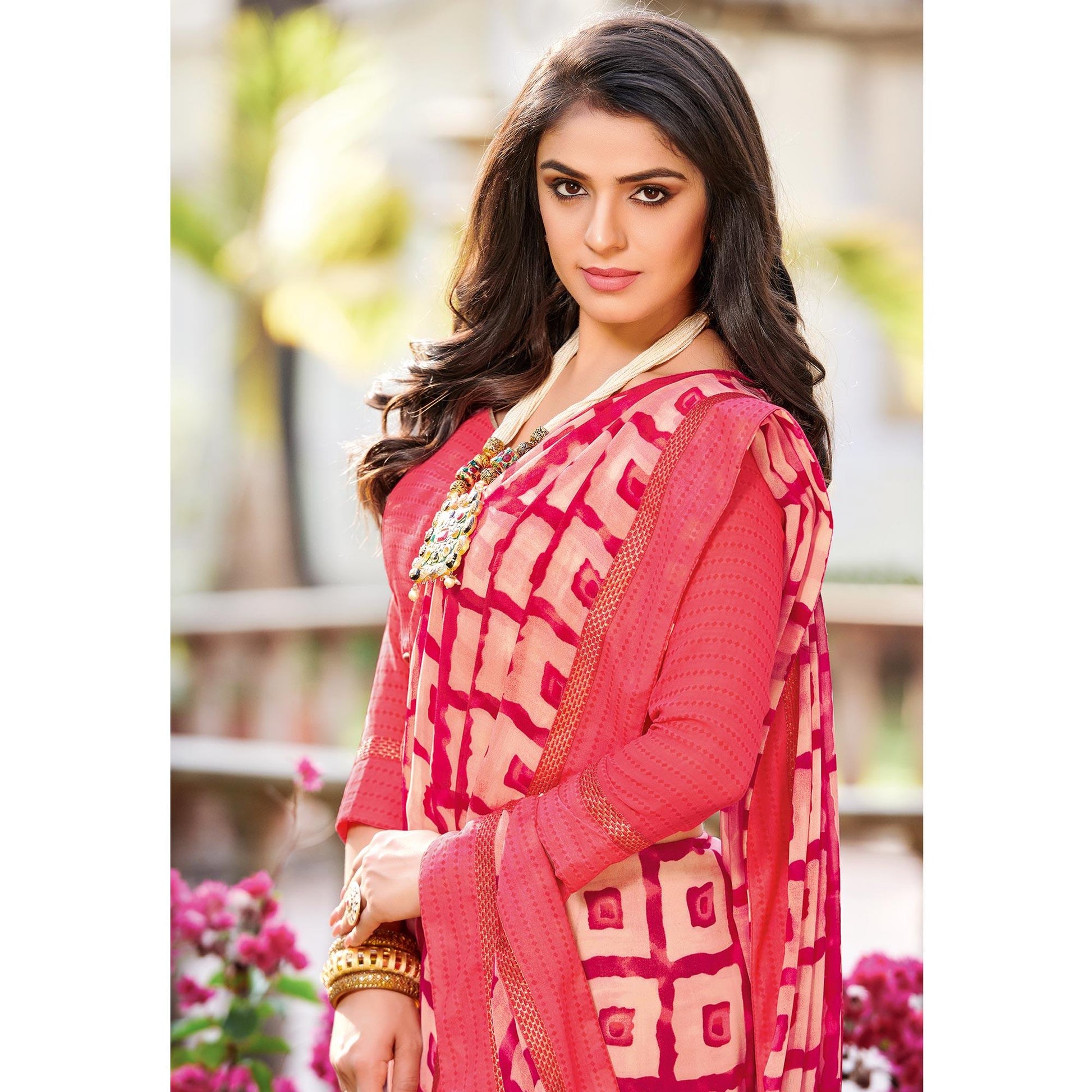 Intricate Peach Colored Partywear Printed Georgette Saree