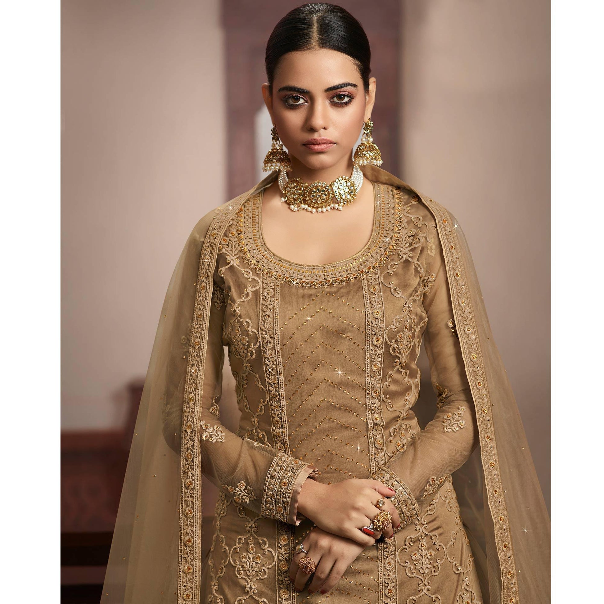 Jazzy Beige Coloured Partywear Embroidered Super Net Sharara Style Salwar Suit