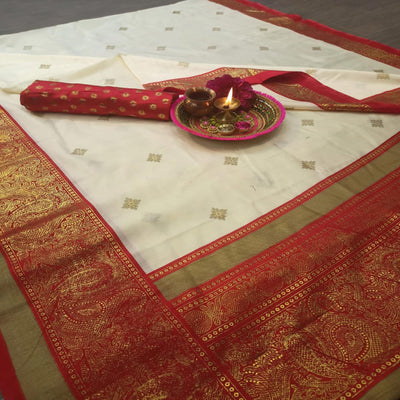 Jazzy Cream-Red Colored Festive Wear Paisely Foli Print Patola Silk Saree