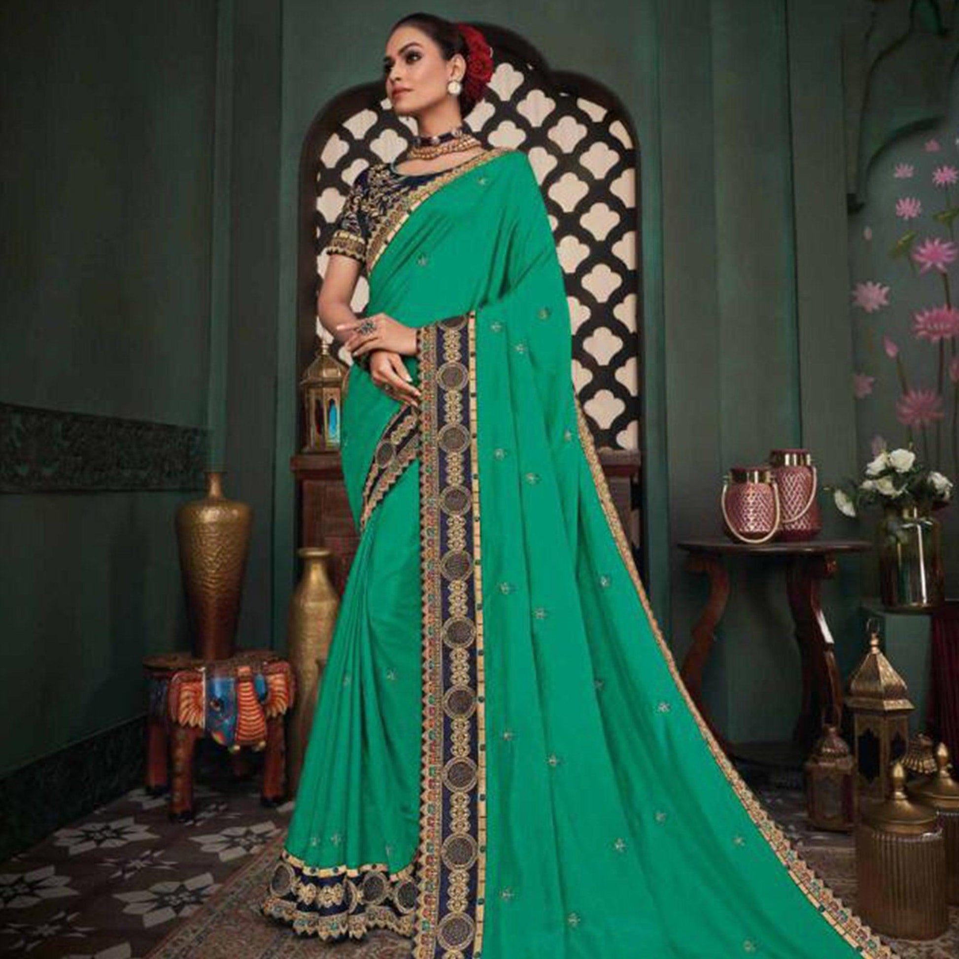 Jazzy Turquoise Green Colored Festive Wear Embroidered Heavy Border Silk Saree