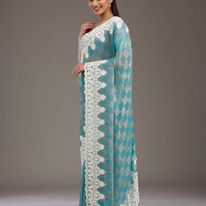 Turquoise Blue Pearlwork Tissue Saree