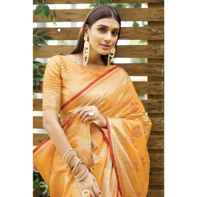 Light Orange Woven Raw Silk Saree With Tassels
