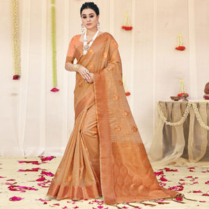 Light Peach Woven Organza Saree With Tassels