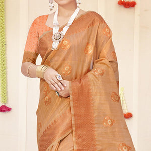 Light Peach Woven Organza Saree With Tassels