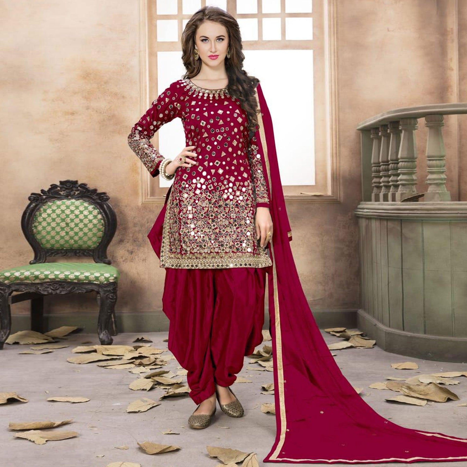 Lovely Red Colored Partywear Embroidered Tapeta Silk Patiala Suit