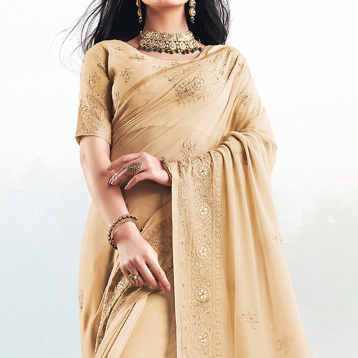 Magnetic Beige Colored Partywear Embroidered Georgette Saree