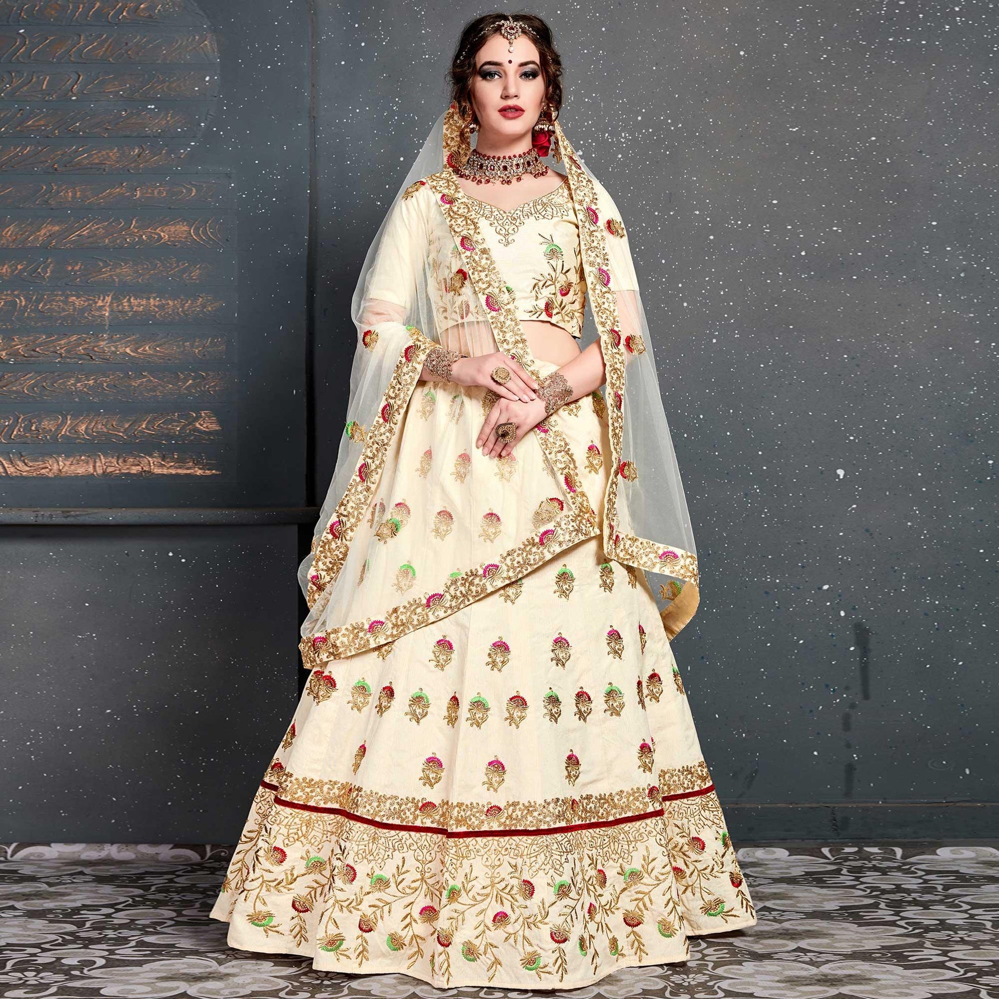 Magnetic Cream Colored Wedding Wear Embroidered Silk Lehenga Choli